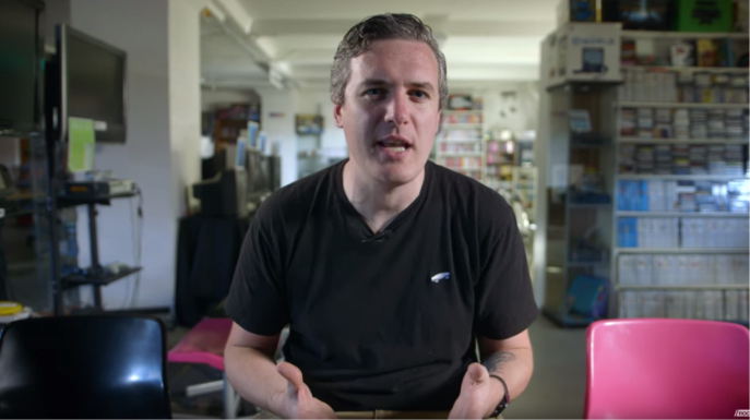 man being interviewed in a classroom
