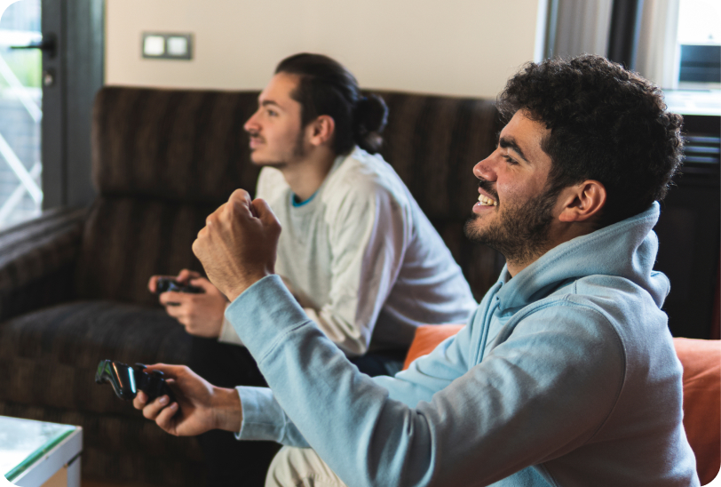 friends sitting on the couch playing video games