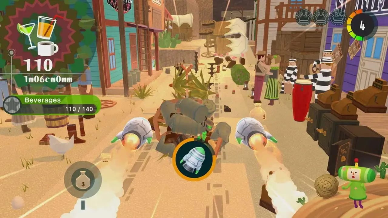 The Prince blasts through the dirt roads of the Wild West using a rocket power up for the Katamari. The surroundings are lined with safes, cacti, and other western themed items.